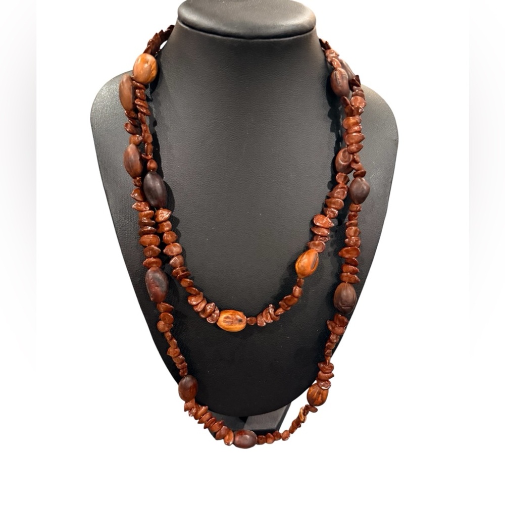 vintage necklace made of wood, nuts, or seeds.